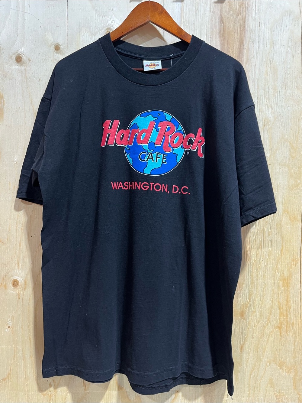 Hard Rock Cafe Black Tee with Red & Blue Globe Graphic. Size Large